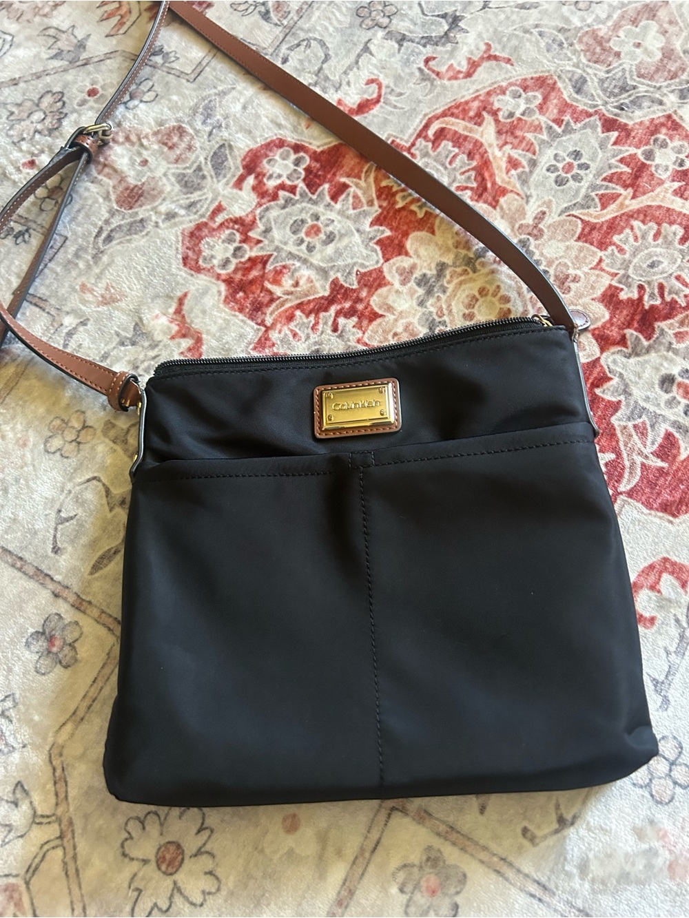 Calvin Klein Black Crossbody with Brown Leather Strap and Gold Plaque